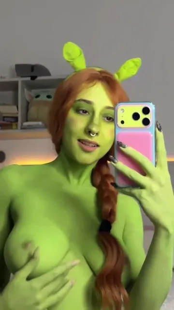 Green-Painted Redhead Takes Topless Mirror Video