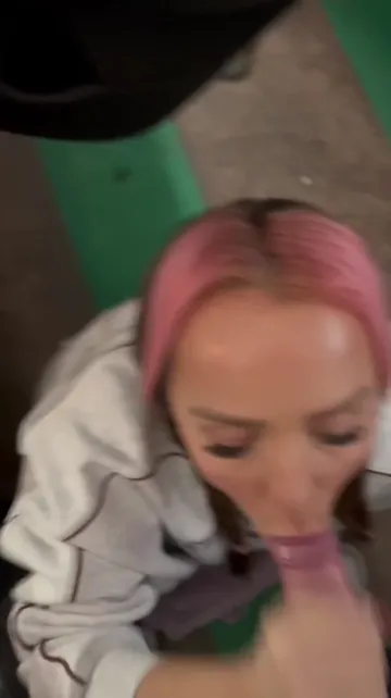 Pink-Haired Woman Performs Oral Sex Outdoors