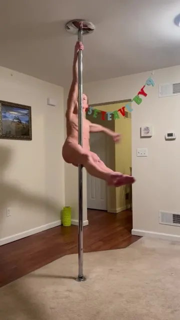 Nude Woman Spins Around a Pole in a Living Room