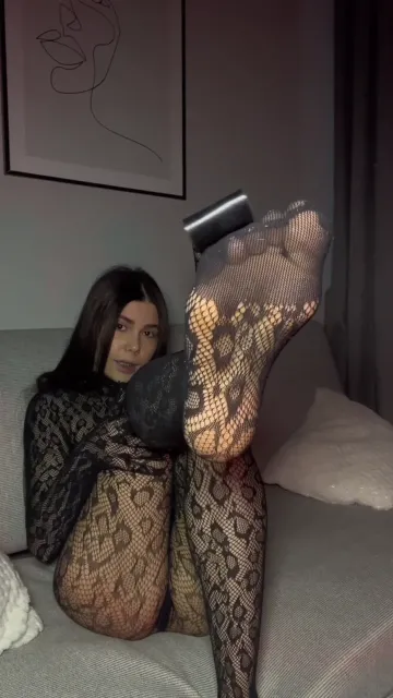 Brunette Shows Patterned Soles and Black Heels