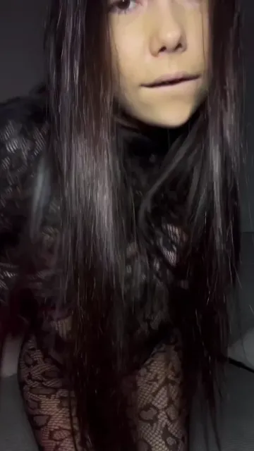 Brunette Turns in a Sheer Patterned Bodysuit