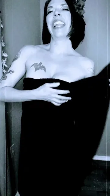 Tattooed Brunette Raises Her Leg in Monochrome