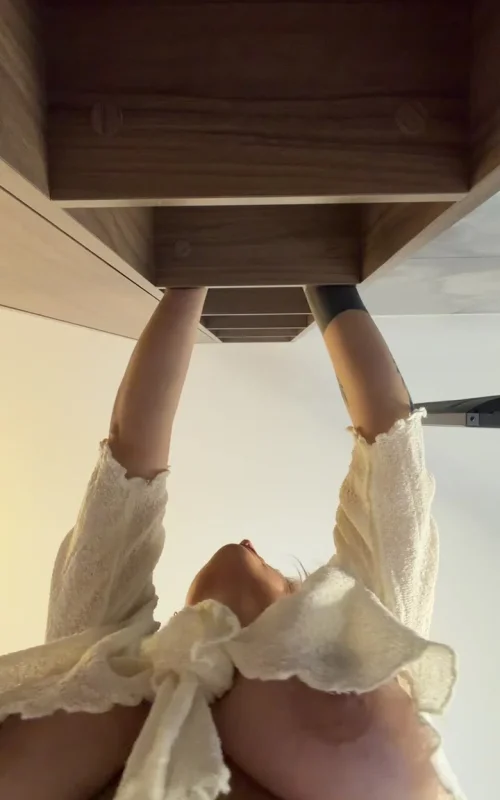 Blonde Lifts Her Blouse for a Low-Angle Camera