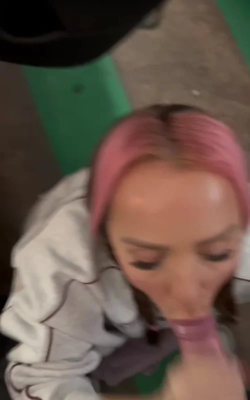 Pink-Haired Woman Performs Oral Sex Outdoors