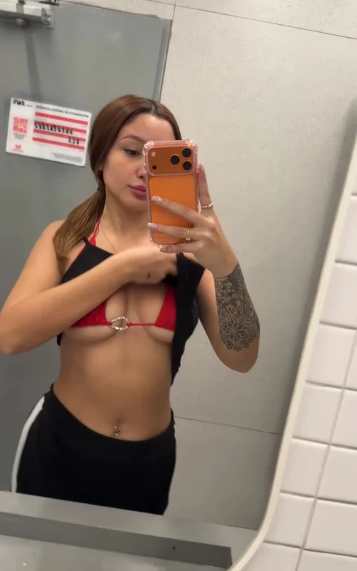 Brunette Reveals a Red Bra in a Bathroom Mirror