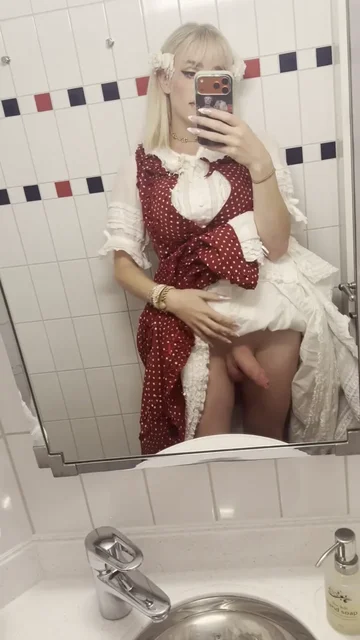 Blonde Lifts Red Dress in Bathroom Mirror