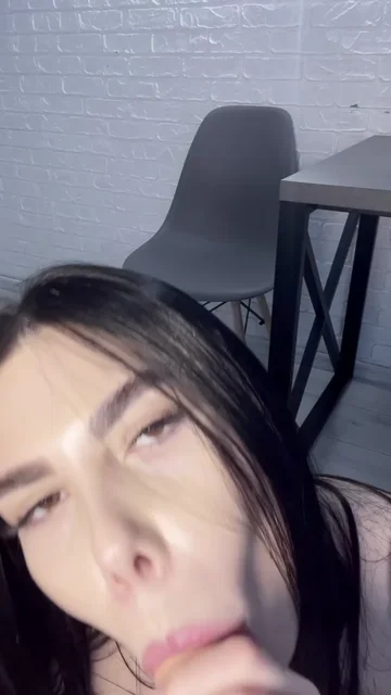 Brunette Sucks a Dildo in a Close View