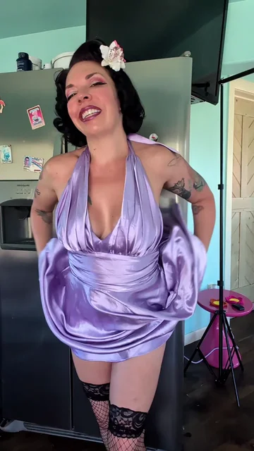 Brunette Lifts Lavender Dress and Turns Around
